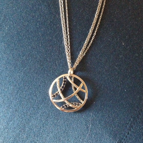 Silver, sapphire, and diamond necklace.