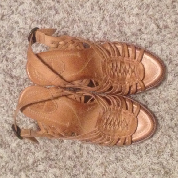 Leather high heels with sling-back.