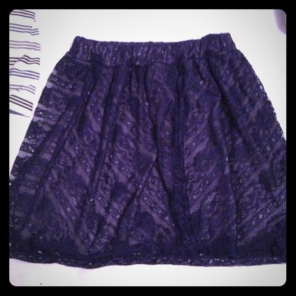 A blue lace skirt, waistband is a little twisted