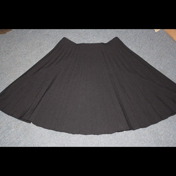 Black pleated knee length skirt