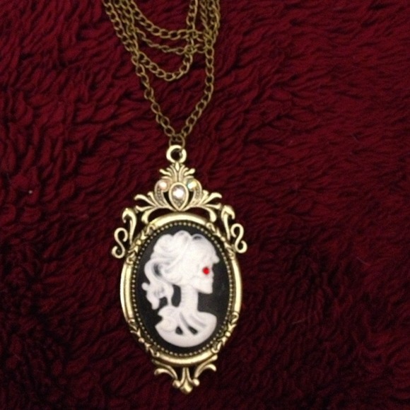 FREE WITH $25 PURCHASE! Skeleton female necklace.