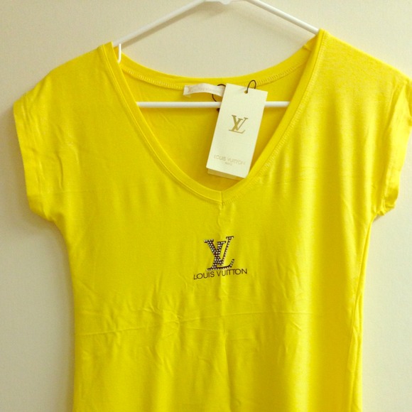LV yellow shirt and Bulgari earrings