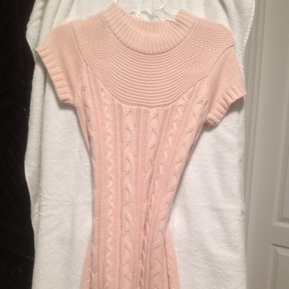 Cable knit, capped sleeved peach-colored dress.