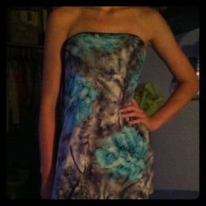 A silky,  back hand-tied decorative strapless top