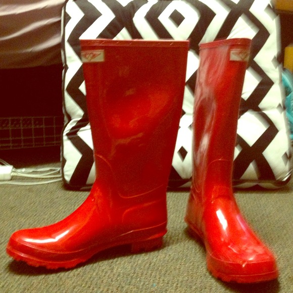 Red knee high rubber rainboots