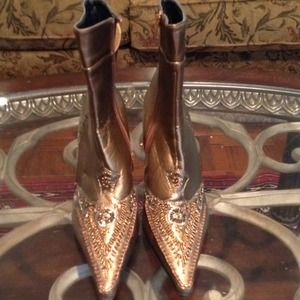 Gold detailed ankle boots