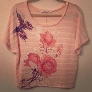 Knit light pink shirt with with stripes.