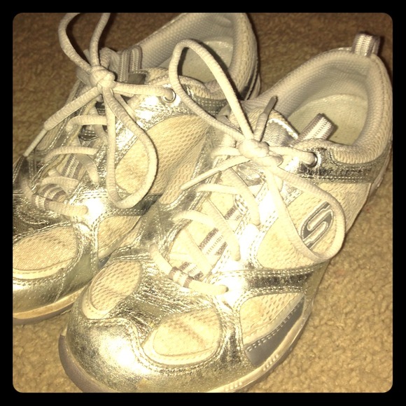 Sketchers sport white and silver shoes