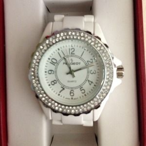 White ceramic watch with crystals on the face