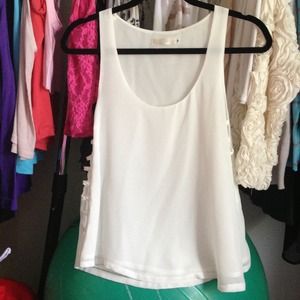White flowy open side tank