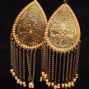 Coral beaded dangle earrings with gold platform.
