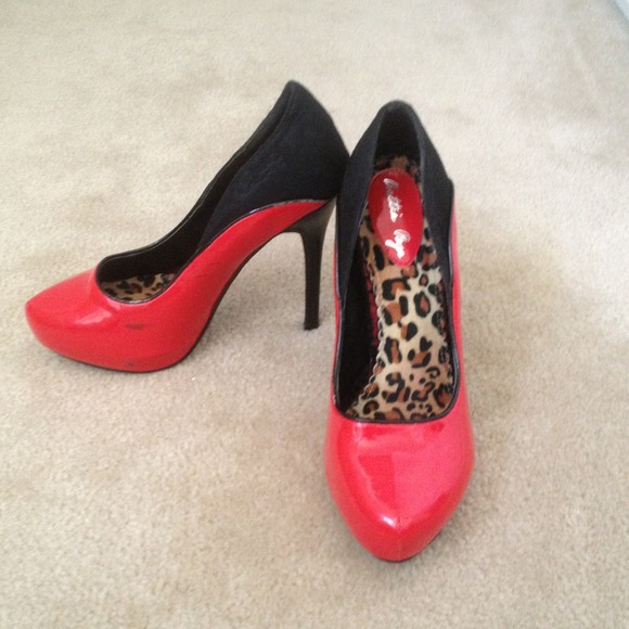 Red pumps with black lace detail