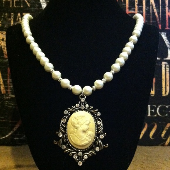 Jewelry of the Future Jewelry - Cameo Necklace & Blue Topaz Pendant