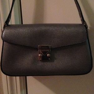 Used small silver Guess purse