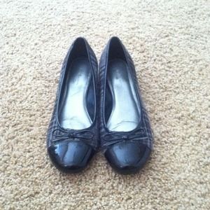 Soft material flats with 1 inch heel.