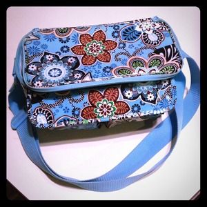 Vera Bradley lunch bag with outside pockets.