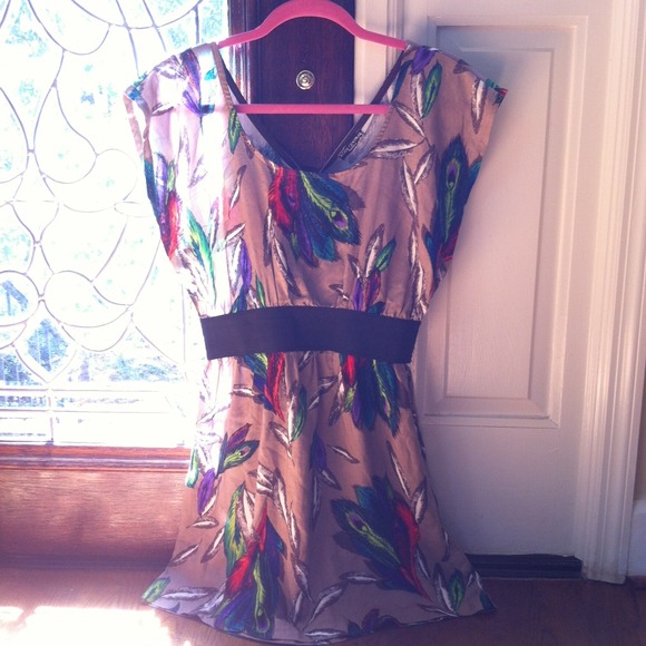 Nude dress with neon feathers and open back