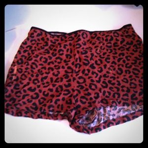 High-waisted, burnt orange, leopard print shorts!