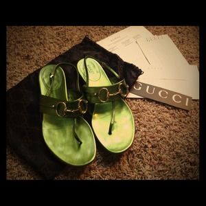 Gucci metallic green leather sandals .