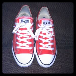 Orange/red low rise converse.