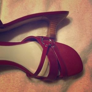 Ruby red shoes with short heel.