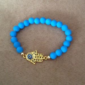 Gold hamsa with evil eye bracelet
