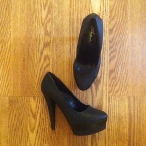 Sky high black pumps