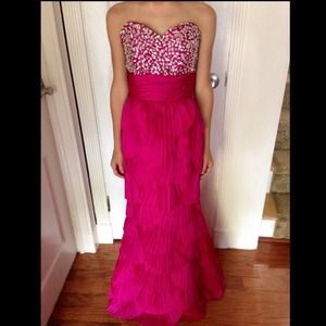 Pink tulip dress with embellishment on the bust.