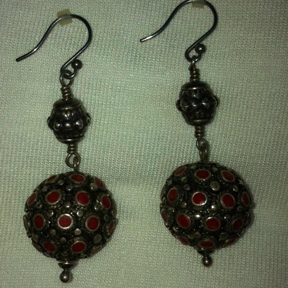 Silver and coral colored earrings