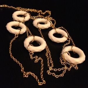 Long gold chain necklace with white circle accents