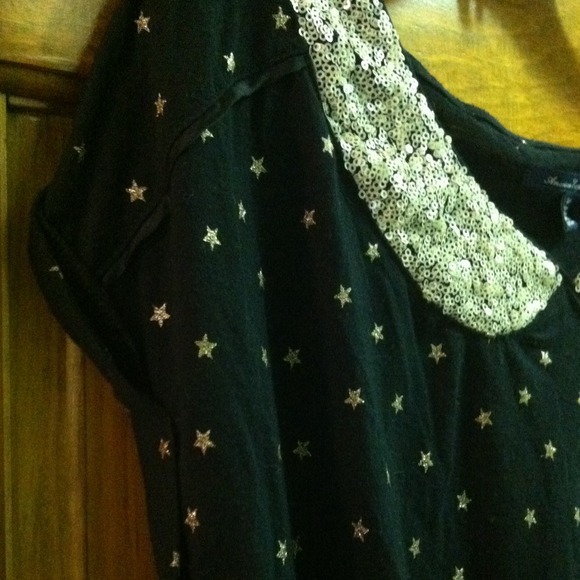 Black top with gold accents