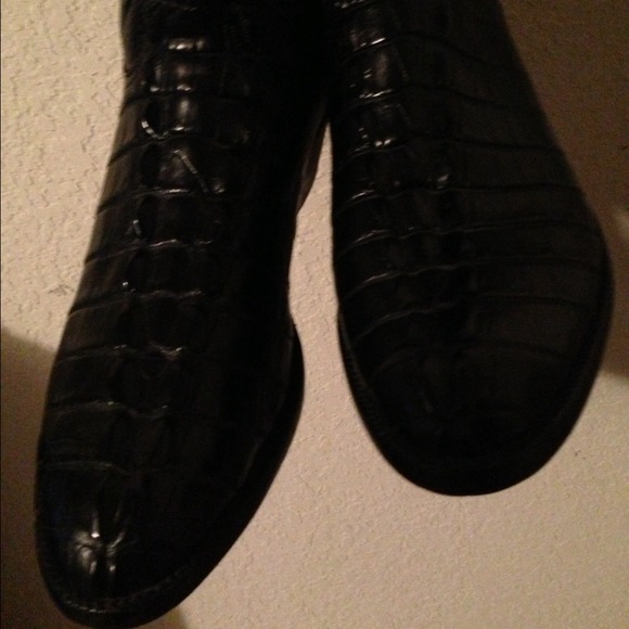 Lucchese gator boots.