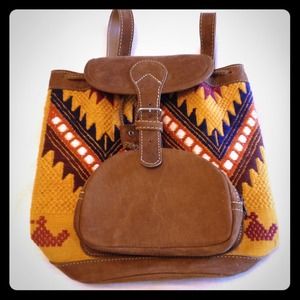 Small leather and woven Aztec print backpack.
