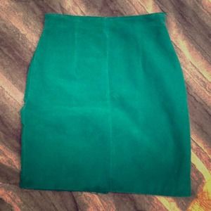 Suede, vintage high-waisted green skirt.