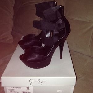 Black satin, stretch platform heels.
