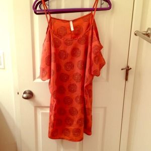 An off the shoulders orange dress