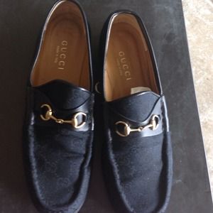 Black Gucci embossed loafers