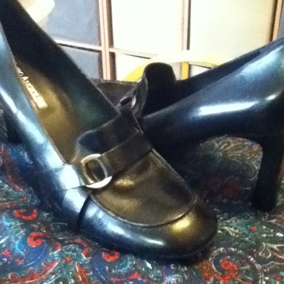 Black leather pumps