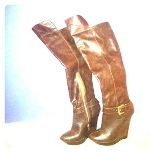 Colin Stuart over the knee brown boots.