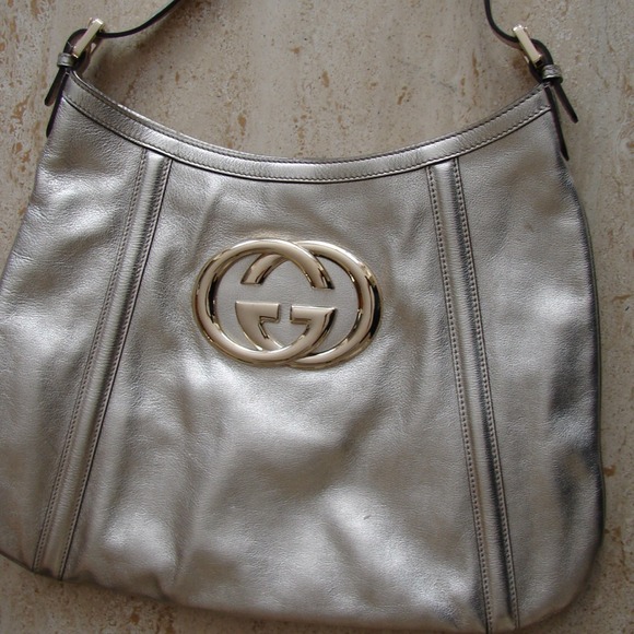 Sold . . . Platinum gucci purse