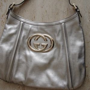 Sold . . . Platinum gucci purse