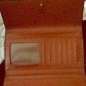 Inside of the Louis Vuitton clutch