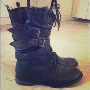 Black combat boots with straps