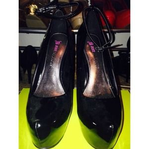 Black patent with ankle strap pumps.