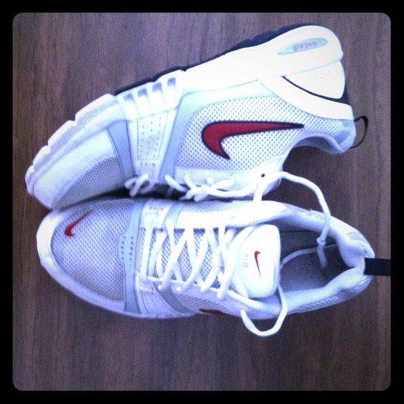 White and red nike air running shoes.