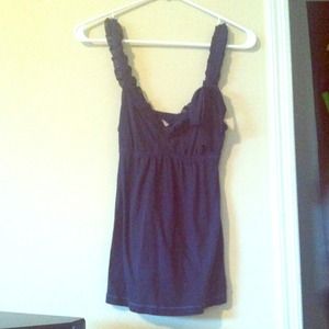 Small navy blue hollister top with ruffles/bow.
