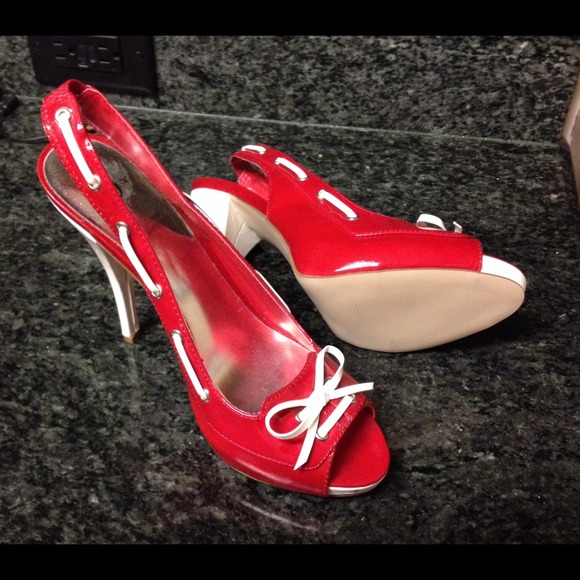 Red, trimmed in white, high heels.