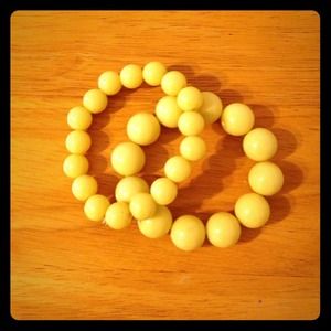 Two yellow beaded bracelets