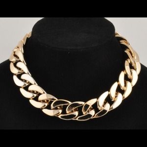 Chunky gold bib chain.