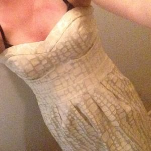 cream and silver colored strapless dress